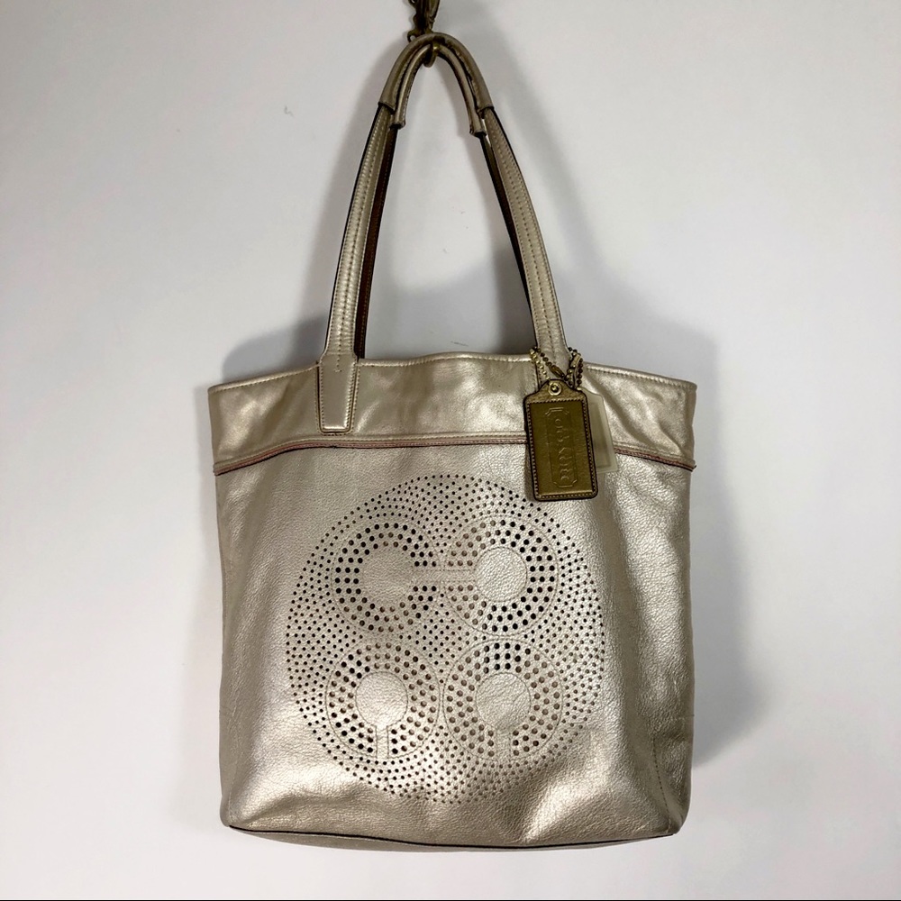 Coach Audrey Leigh metallic gold laser cut leather tote bag.